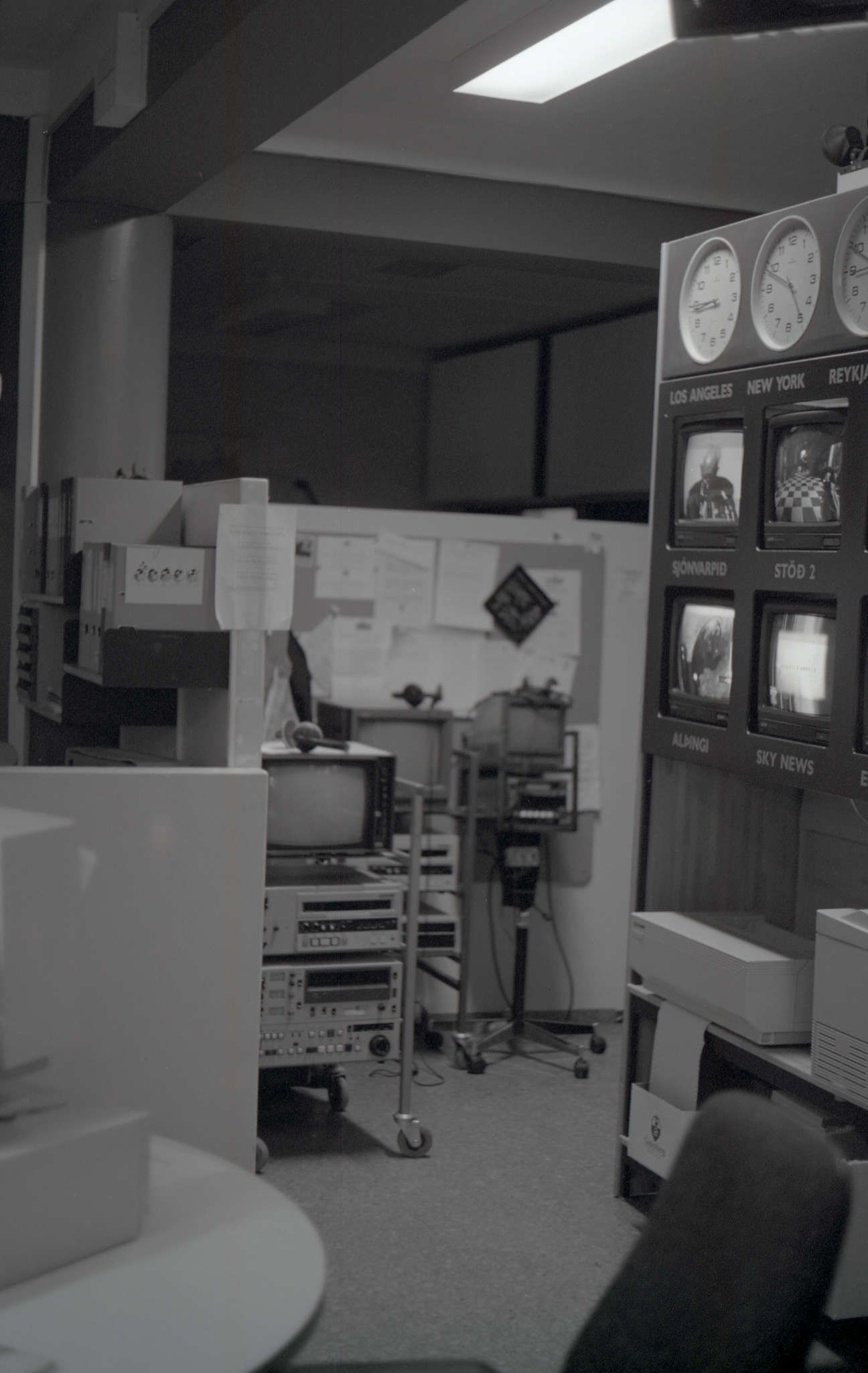 A photo of the old TV newsroom. You can see the desks and the wall of screens showing both the current broadcast and other channels.