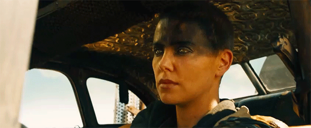 Furiosa looks at you from inside a truck.