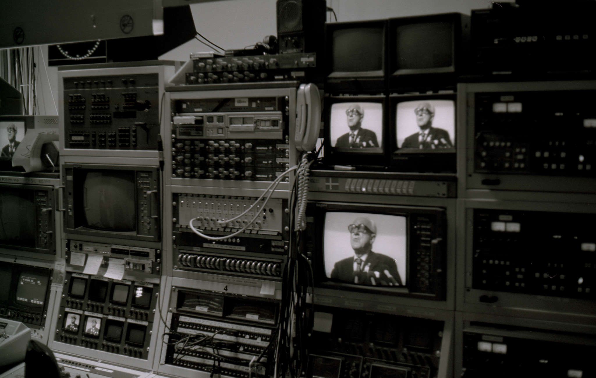 The tiny newsroom filled with gear that was obsolete even then. You can see Laxnes's face on several screens.